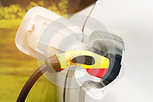 Charging electric vehicles with an electric cable with the image of the flag of Spain