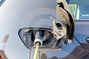 Charging elektric car at home photo