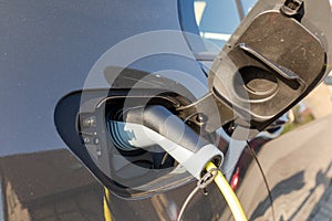 Charging elektric car at home photo