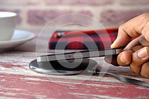 Charging Smartphone Using Wireless Charging Pad, top view