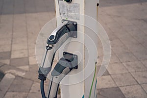 Charging station for electric car. Vehicle and infrastructure-side connectors and sockets for AC and DC charging.