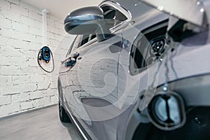 Charging station of a modern electric car. The back of the electric crossover