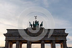 Chariot sculpture and top part of Brandenburg Gate before the sunset in Berlin