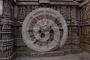 A chariot wheel carved into the wall of the 13th century Konark Sun Temple, Odisha, India.