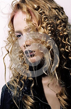 Charisma. Individuality. Young Woman with Curly Hairs