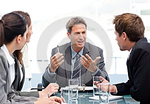 Charismatic chairman talking with his team photo