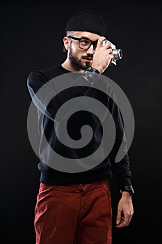 Charismatic guy in sweater , glasses photo camera