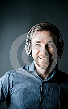 Charismatic happy man enjoying his music