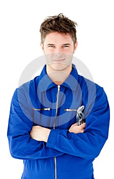 Charismatic mechanic holding tool and smiling