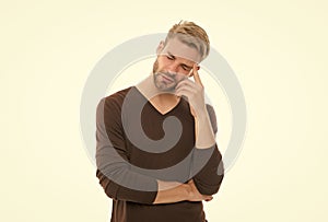 charismatic thoughtful guy with trendy hairstyle wearing clothes in casual style having headache isolated on white, male