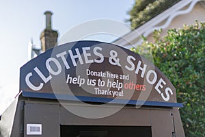 A charity clothes and shoes donation box