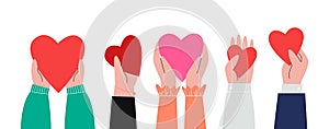 Charity concept, share your love. Friend holding red hearts in hands. Volunteer donate, social support or health helping