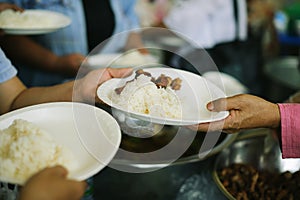 Charity food is the hope of the poor who have no money: concept of begging food : Volunteers Share Food to the Poor to Relieve