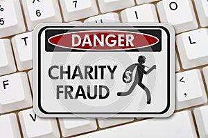 Charity fraud danger sign with a thief