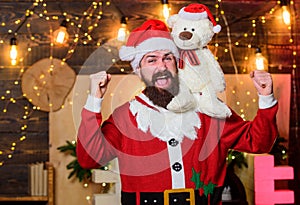Charity for kids. Man bearded Santa claus play soft toy teddy bear. Christmas charity. Charity help. Spread joy