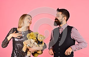 Charity and love. Couple in love holds heap of bears