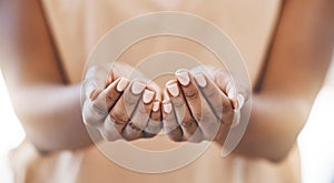 Charity, open hands and a praying woman in a christian worship church for spiritual wellness. Closeup of palms of an