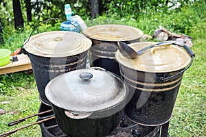 Charity outdoor food. Large buckets of food for a charity lunch