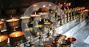 Charity. Praying candles in a church.