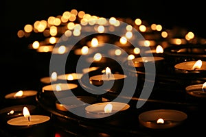 Charity. Praying candles in a temple.