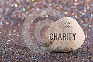 Charity on stone