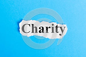 charity text on paper. Word charity on a piece of paper. Concept Image