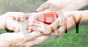 Charity Transparent Text Effect, old and young hands, red heart image cut, white background.