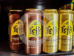 Leffe Blonde and brown belgian beer cans in a grocery store