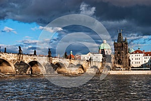 Charles bridge across the river in old town of Praha