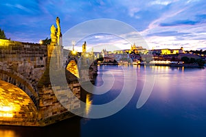 Charles Bridge and Hradczany in Old Town of Prague during evening in Czech Republic