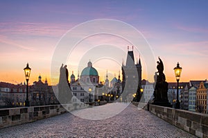 Charles Bridge (Karluv Most) and Old Town Tower, the most beautiful bridge in Czechia. Prague, Czech Republic. photo