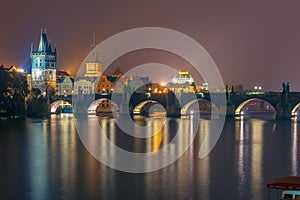 Charles Bridge at night in Prague, Czech Republic