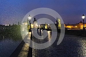 Charles Bridge at night in the rain in the Czech Republic