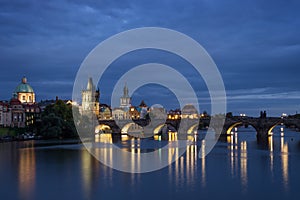 Charles Bridge and old buildings in Prague at night