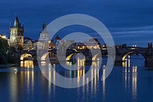 Charles Bridge and old buildings in Prague at night