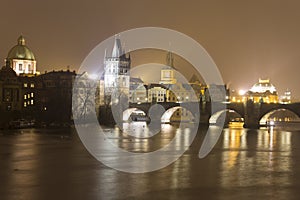Charles bridge and other historic buildings at night, Prague, Czech republic
