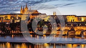 Charles Bridge over the Vltava River in Prague with castle in the background.