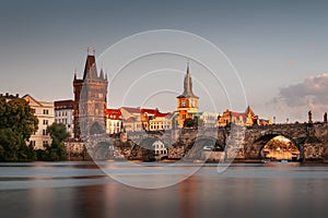 Charles Bridge over the Vltava river at sunset in Prague, Czech Republic