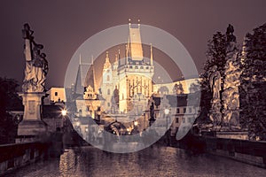 Charles Bridge in Prague at night - vintage colors