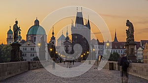 Charles Bridge in Prague before the sunrise night to day timelapse, Bohemia, Czech Republic.