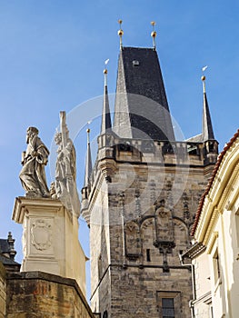 Charles Bridge with statuette and Bridge Tower - Prague, Czechia