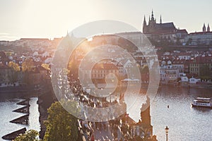 Charles Bridge on Vltava river in Prague, Czech Republic at sunset. Prague Castle