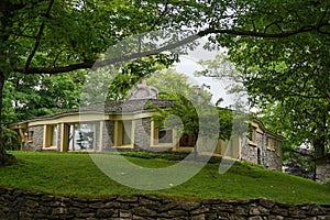 Earl Young`s second personal residence at 308 Park Avenue, famous mushroom house designed by Earl Young, in Charlevoix, Michigan