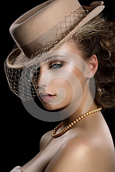 Charm. Retro Styled Romantic Woman in Vintage Brown Hat and Veil. Nostalgia