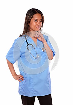 Charming asiatic nurse woman requesting silence