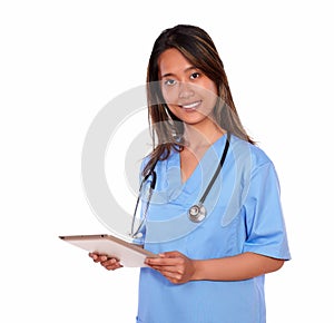 Charming asiatic nurse woman using her tablet pc