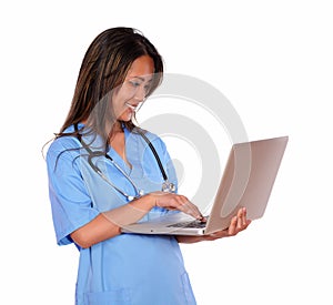 Charming asiatic nurse woman working on laptop