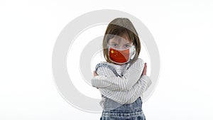 Charming baby, blonde posing on white background. Quarantine, virus and pandemic concept