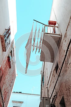 Charming Balcony Scene: Laundry Drying in the Sun