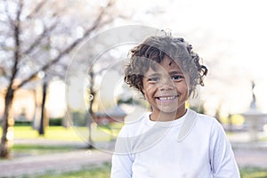 Charming Beautiful Black young boy with a playful smile and curly hair